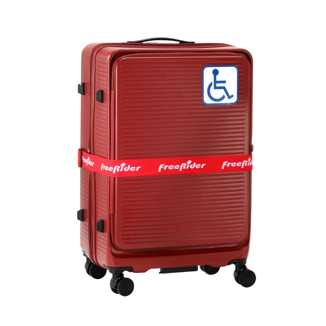 The FreeRider Luggie Suitcase is a red, hard-shell, foldable travel case with four wheels, black handle, and red freerider strap. It features a blue and white wheelchair symbol for accessible scooter transport.